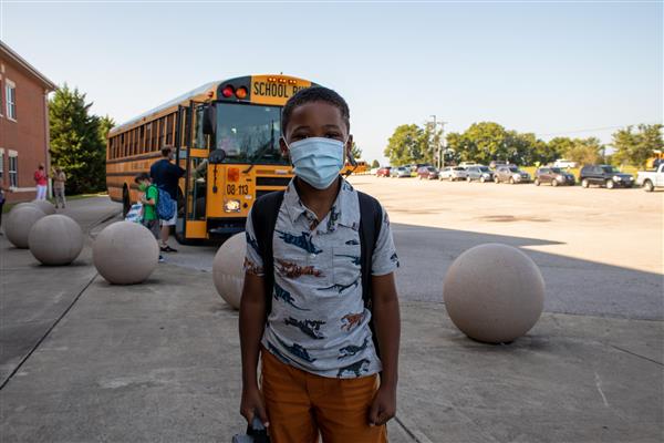 student smiles on first day of school